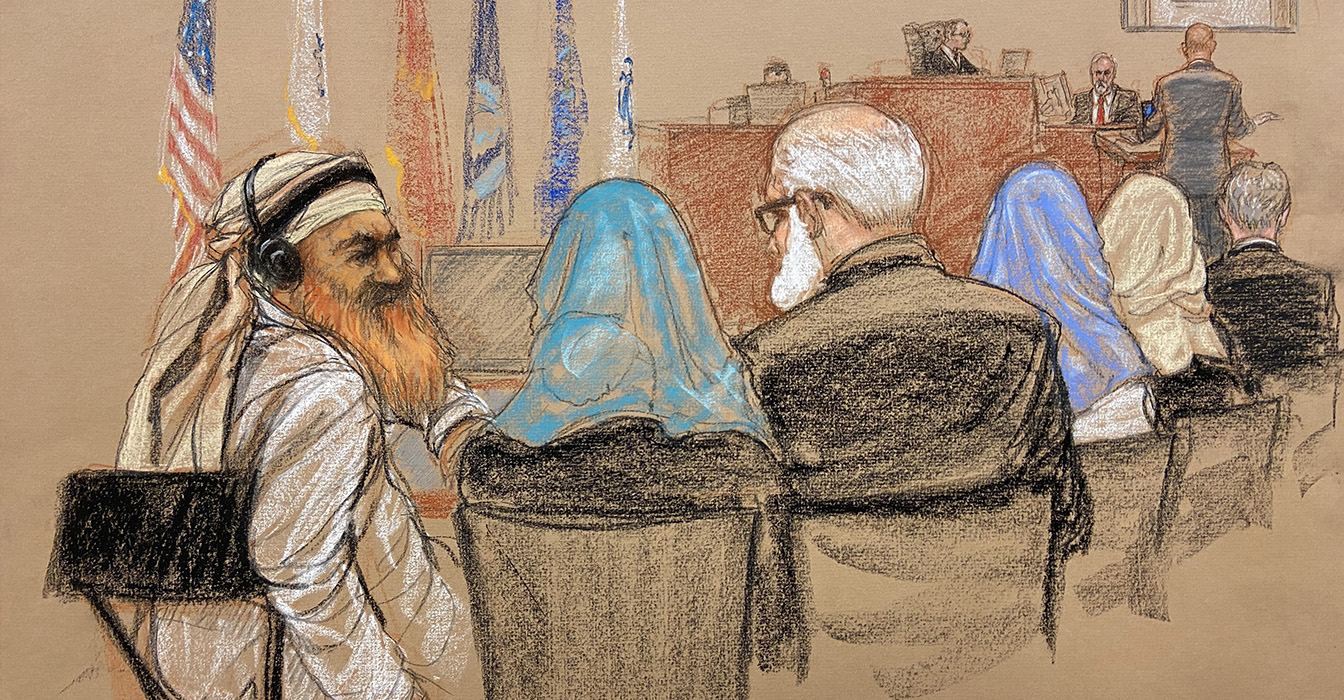 Sketch by Janet Hamlin. Khalid Shaikh Mohammad (left) confers with his defense team.
